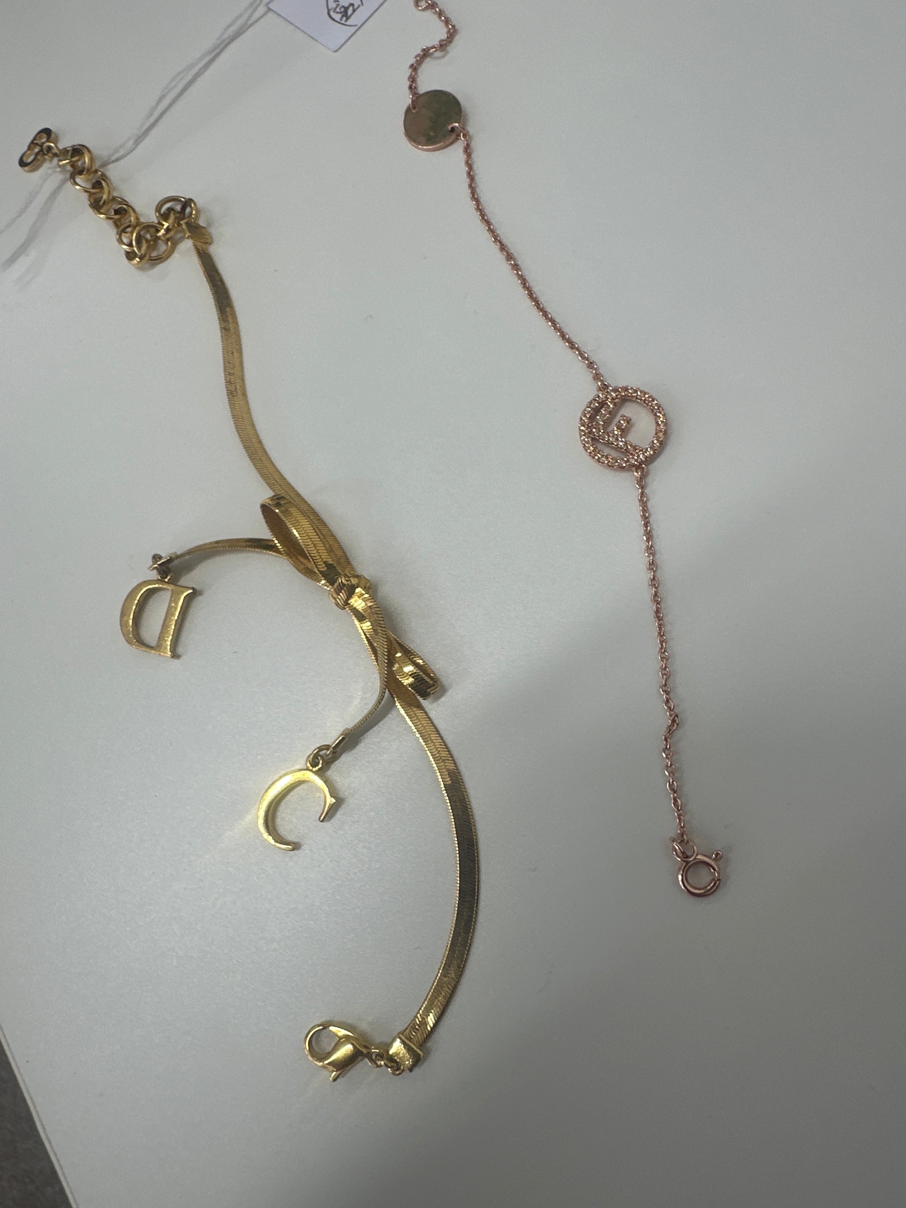Fendi pink gold and CD bow bracelets seaston11