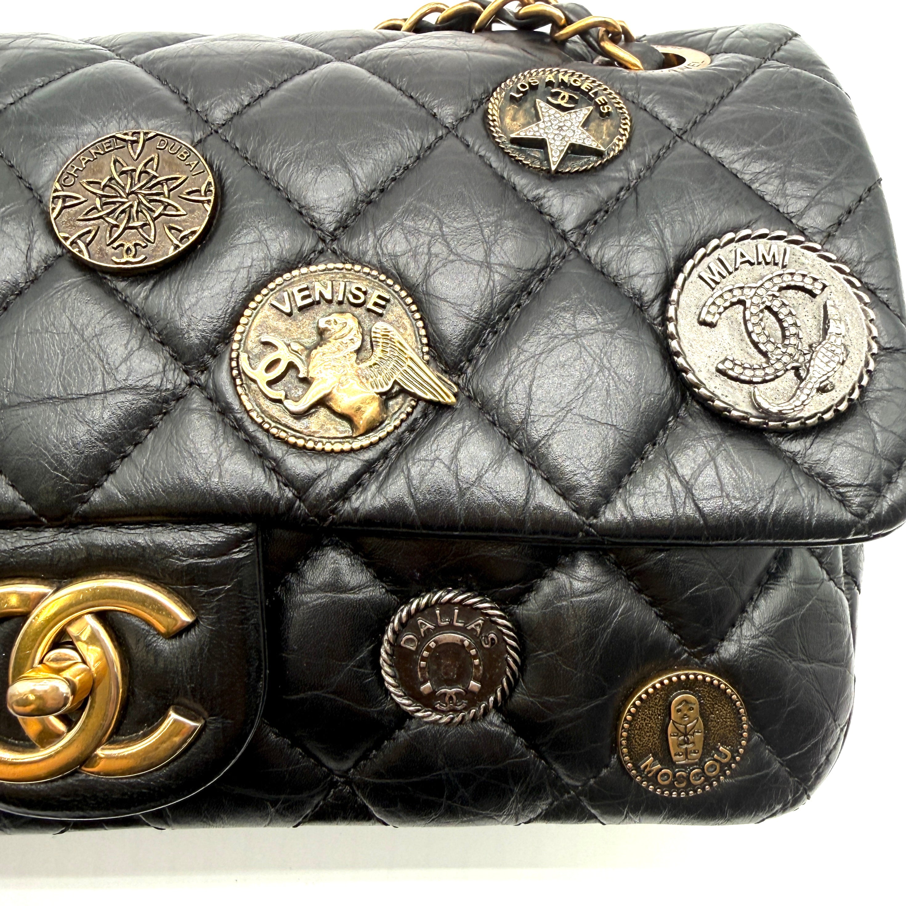 Chanel | Quilted "Around the World" Coin Flap Bag | Black Aged Calfskin | Gold & Silver-Tone Hardware | Series 20 (~25cm)