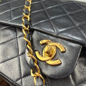 Chanel - Classic Double Flap in Black Leather (Excellent Condition) - CONS